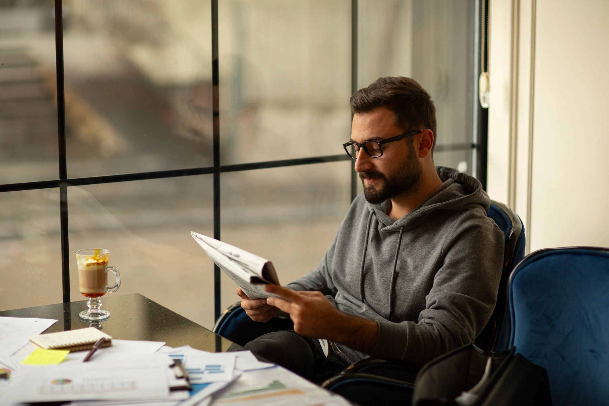 editor reading submissions newspaper